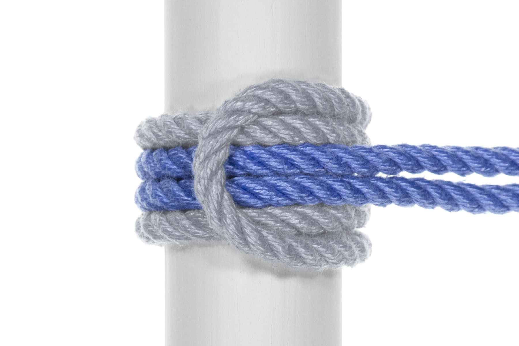 The top and bottom halves of the knot have been separated, making room for an additional pass of rope in between them. The standing part of the rope has wrapped around the pole and under the bight, so there are now four strands of rope circling the pole. The two strands of the standing part are in the center of the knot, with the strands of the original lark’s head above and below them.