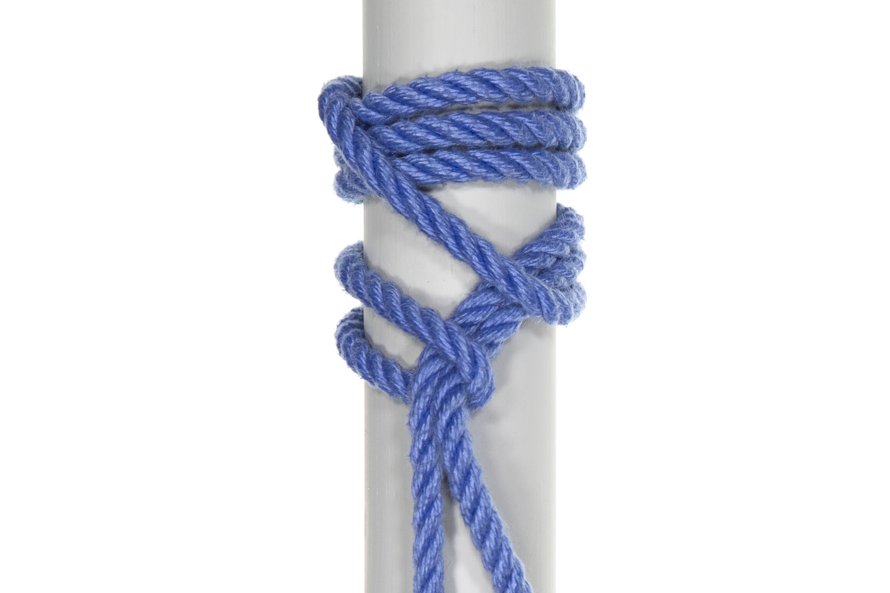 A completed icicle hitch on a three inch diameter gray pole. The icicle hitch is tied around the pole, with the standing part of the rope hanging down below it. This knot is confusing to inspect visually. Three snug wraps go around the pole at the top of the knot, lying next to each other. The rest of the  knot is spread out over several inches, with the standing part going down the pole and crossing under a single strand of rope and through a bight.