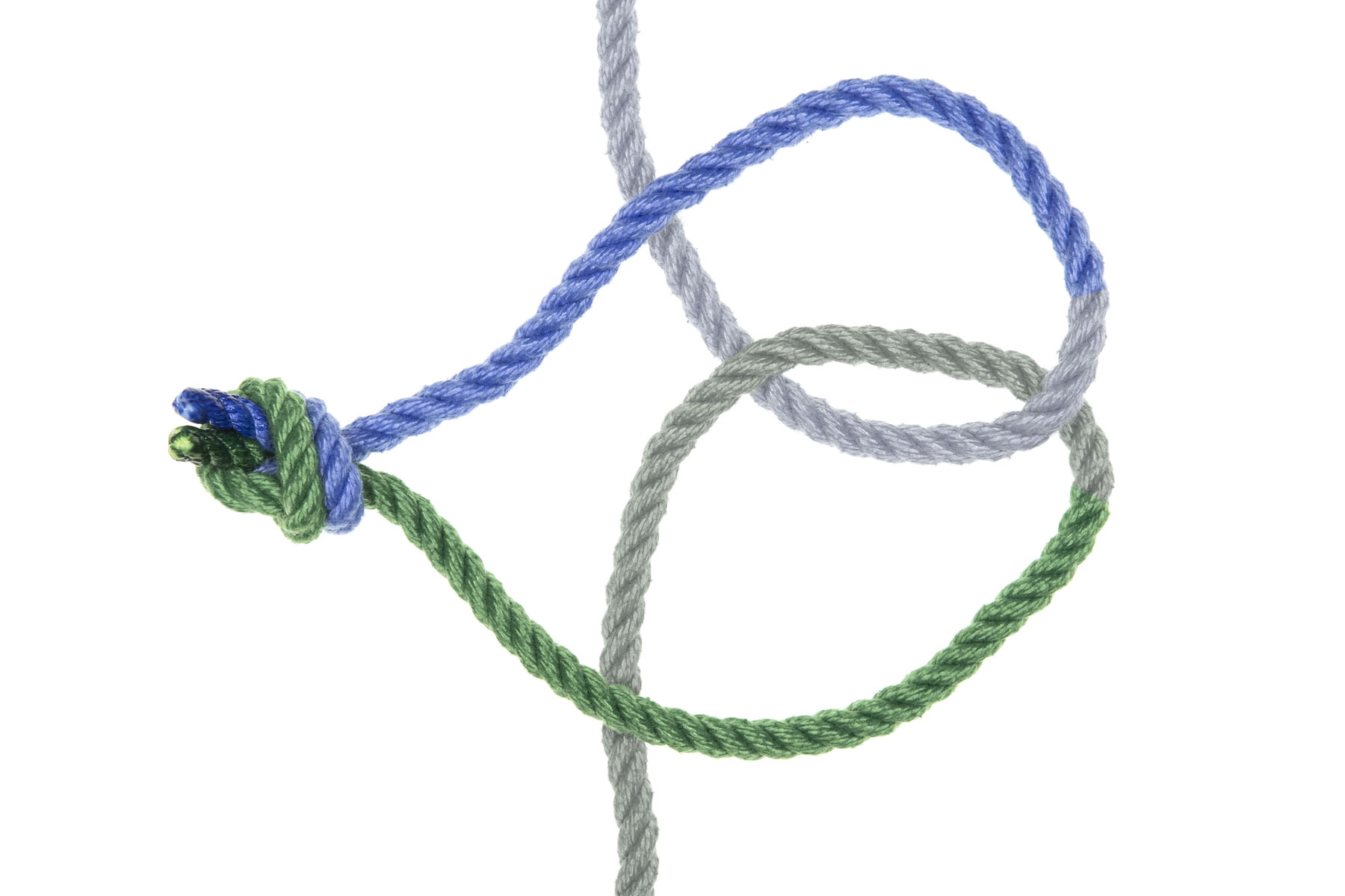 The second, larger, loop has been flipped over to the left, right after the crossing where the blue rope goes over the green rope. The overhand knot now lies to the left of the vertical parts of the ropes.