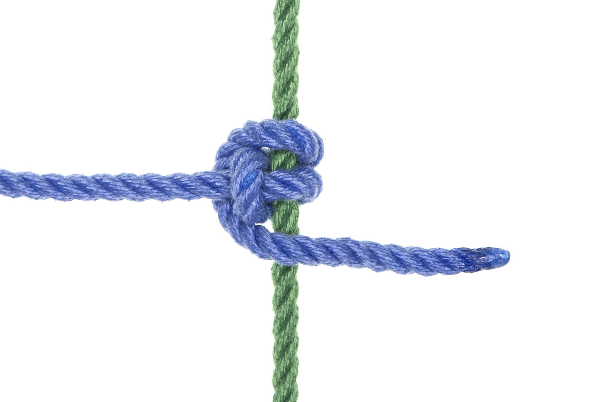 A single strand of blue rope crosses a single strand of green rope, making a super Munter friction around it before continuing. The blue rope crosses over the green rope three times and goes around its own standing part twice.