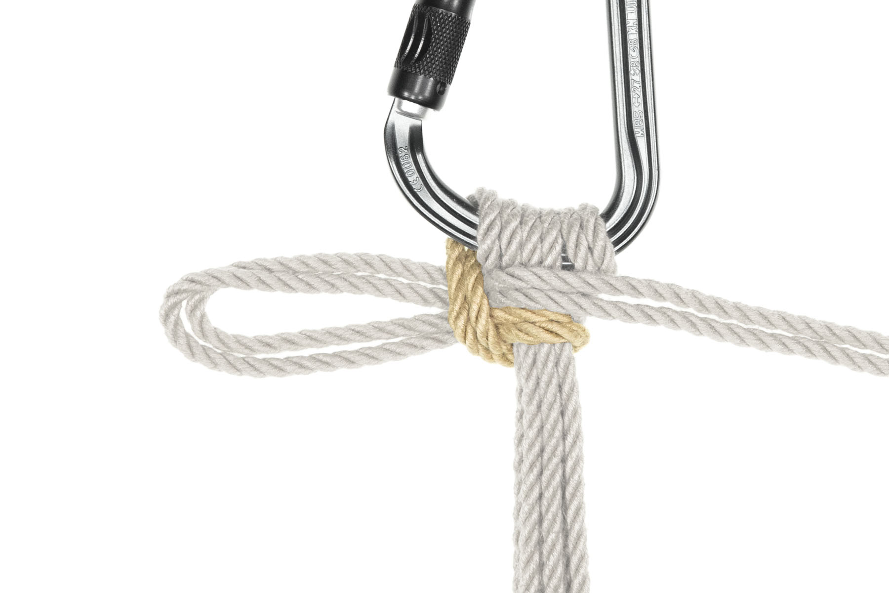 The triangle has been snugged down, so that the rope now makes a slipped half hitch, with the bight pointing to the left and the end of the rope exiting the image to the right.